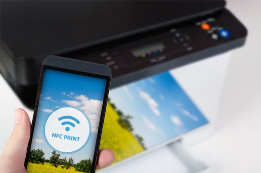 Wireless easy printing with Near Field Communication technology. NFC devices in office