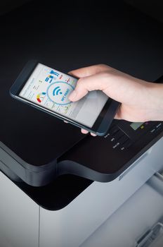 Wireless easy printing with Near Field Communication technology. NFC devices in office