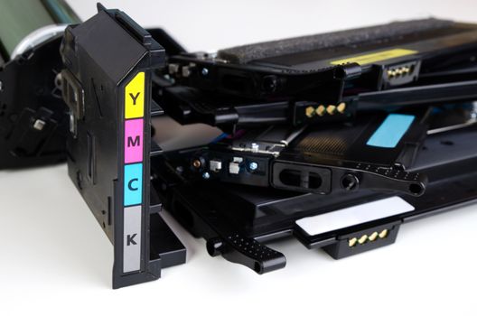 Toner cartridge set for laser printer. Computer supplies on white background.