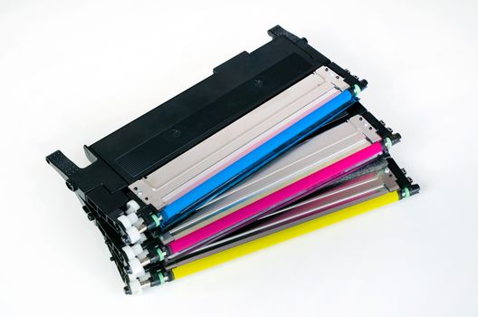 Toner cartridge set for laser printer. Computer supplies on white background.