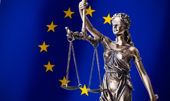 Themis with scale, symbol of justice on European Union flag background composition