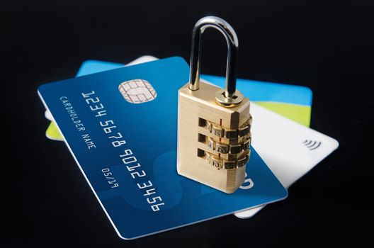 Security lock on multiple blank credit cards close up