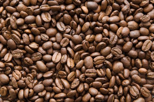 Roasted coffee beans texture. Grain background for your composition