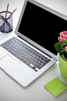 Laptop on desk in modern office mockup. Use for web design presentation