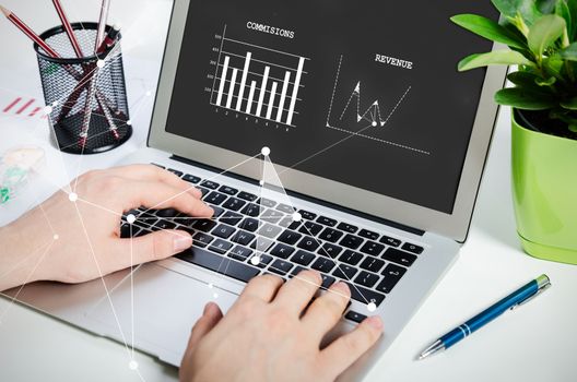 Man working with modern laptop in office. Hands typing on keyboard