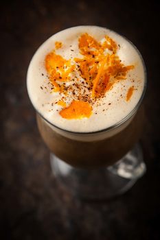 Irish coffee with orange peel top view