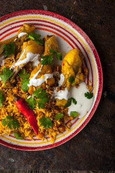 Chicken curry on the stone table vertical