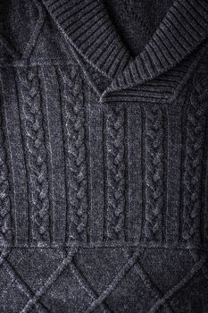 Grey figured sweater background vertical