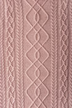 Pink figured sweater background vertical