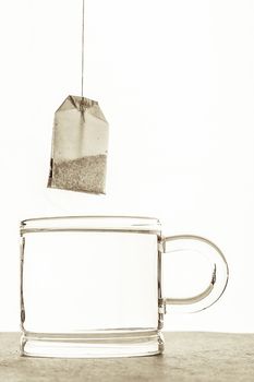 Tea bag with cup of water  on the white background