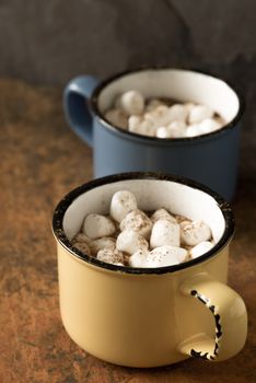 Cups of cocoa with marshmallows vertical