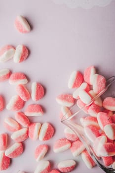 Fruit jellies  on the pink background vertical