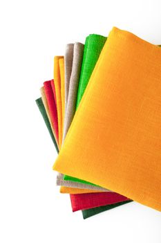 Stack of colorful napkins on the white background  top view