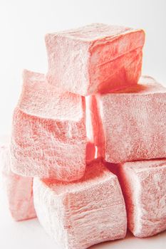 Pink Turkish delight on the white background close-up