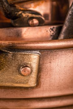 Copper pots and pans background vertical