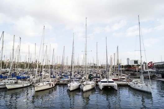 BARCELONA, SPAIN - OCTOBER 09, 2015: Yachts docked at Port Vell in Barcelona, Spain