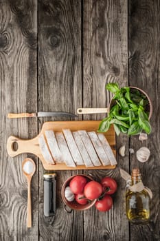 Ingredients for  bruschetta on the wooden table vertical