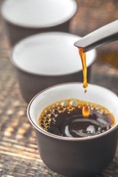 Pouring tea into a bowl