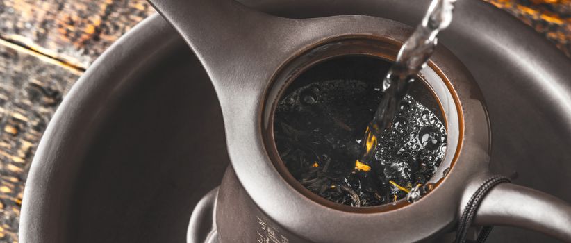 Brewing tea in the teapot wide screen