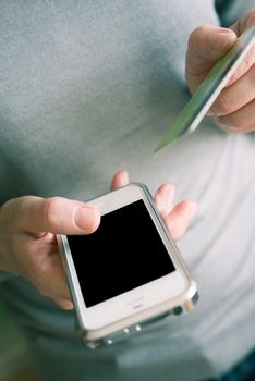 Woman makes a mobile payment