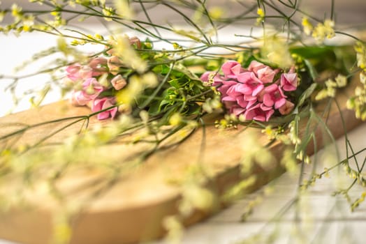 Summer flower on the wooden board  horizontal