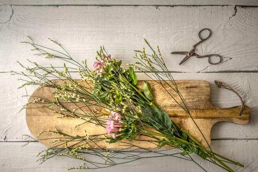 Summer flower on the wooden board  top view