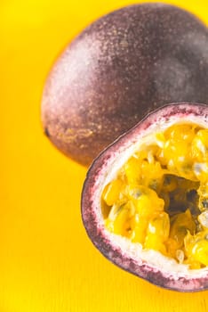 Passion fruit on the yellow background vertical
