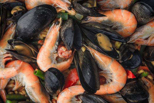 Paella with seafood background close-up