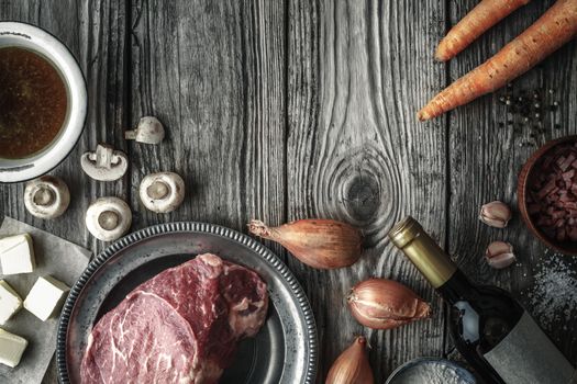 Ingredients for Boeuf Bourguignon on the old wooden table horizontal