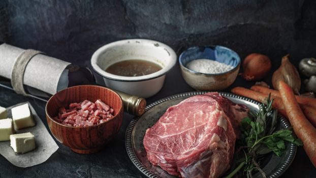 Ingredients for Boeuf Bourguignon on the  dark stone  table horizontal