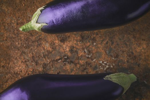 Eggplants on the brown stone background  horizontal