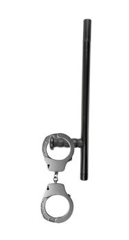 Rubber baton lying and handcuffs on a white background