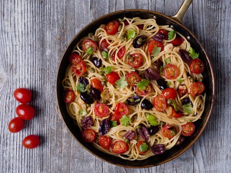 close up of rustic italian spaghetti puttanesca pasta