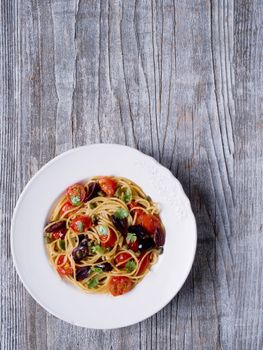 close up of rustic italian spaghetti puttanesca pasta