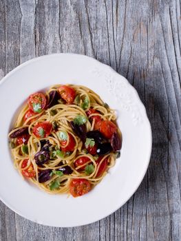 close up of rustic italian spaghetti puttanesca pasta