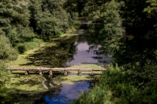 Stone bridge in pond at Nostell Priory England