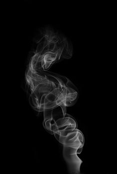 Tobacco smoke. On black background.