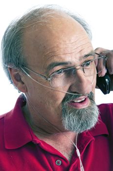 Mature male with a breathing disability talking on his mobile phone.