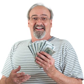 Mature man smiles while holding a handful of American hundred dollar bills. Isolated on a white background.
