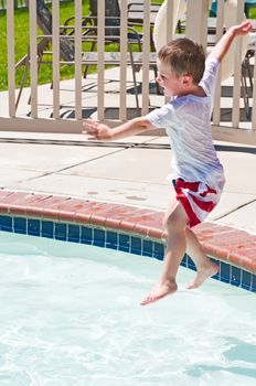 Making a splash by jumping into the water.