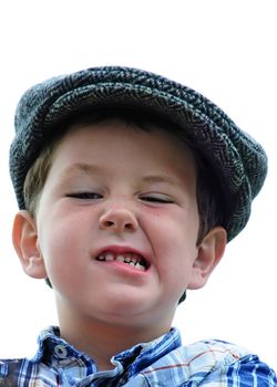 Cute little boy playing like a tough guy in a driving hat.