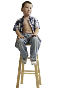 Little boy waiting for a check-up from a doctor.