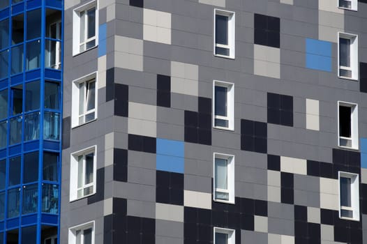 The new house revetted with a multi-colored granite tile in the city of Volgograd