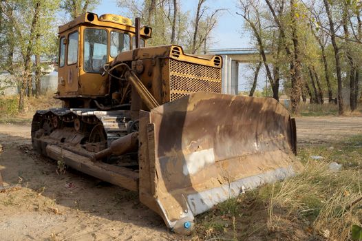 Old big bulldozer for cleaning of large volumes of soil