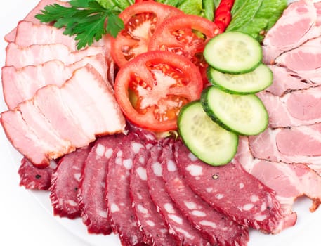 various sliced sausages with vegetables