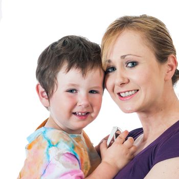 Pretty young woman holding her little boy. Isolated on a white background.