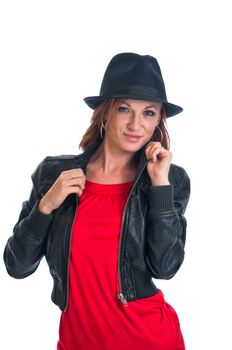 Pretty brunette woman in a red dress, leather jacket and black felt fedora.