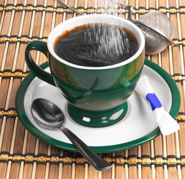 pour sugar into a mug