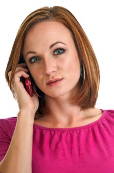 Pretty young adult woman talking on a red cellphone isolated on a white background
