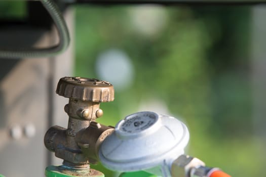 Barbeceue gas bottle closeup with presure indicator